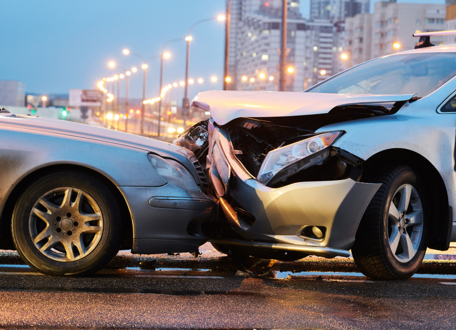 Car accident lawyers in a law office in Pompano Beach reviewing police reports and interviewing witnesses for a traffic accident claim involving a drunk driver and serious injuries like broken bones and a brain injury.