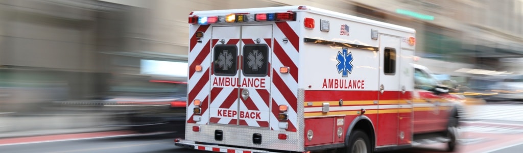 An ambulance transports a Lyft accident victim to the hospital with serious injuries.